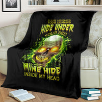 Black oversized blanket on couch with neon green skull artwork and “Inside My Head” text