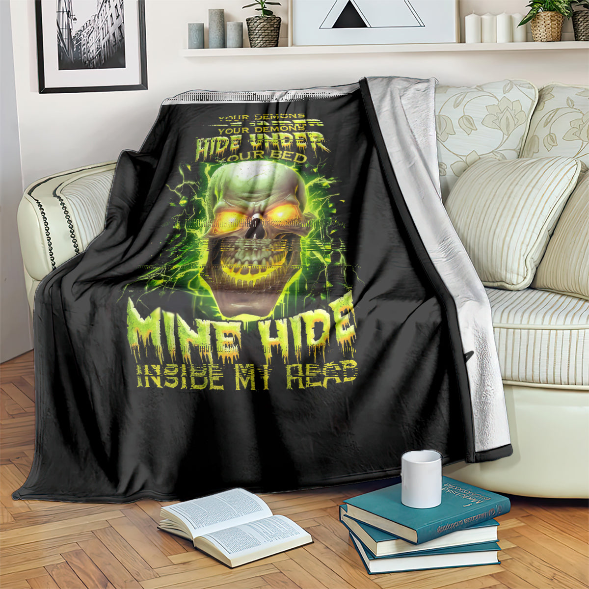 Black throw blanket with green skull graphic, “Hide Under Your Bed” lettering