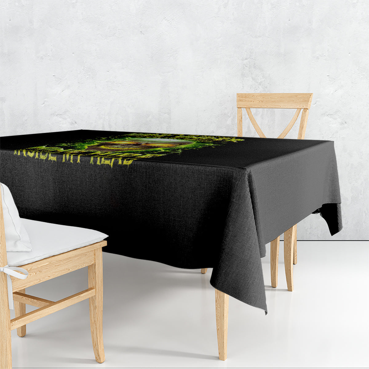 Black tablecloth with neon skull graphic, draped over a square table corner