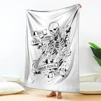 White skull graphic blanket hanging, showing Rock Paper Scissors and 'I Win' slogan