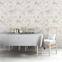 White tablecloth with black skull game print on dining table with neatly draped edge