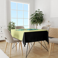 Yellow tablecloth with turtle skull graphic and black drape on dining table