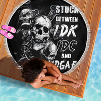 Black round beach blanket with white skull graphic and fringed edge, 150cm
