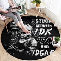 Black round rug with skull and graffiti-style text graphic, laid on wooden floor