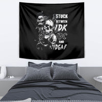 Black skull tapestry with three skulls and stacked text design, hanging on wall