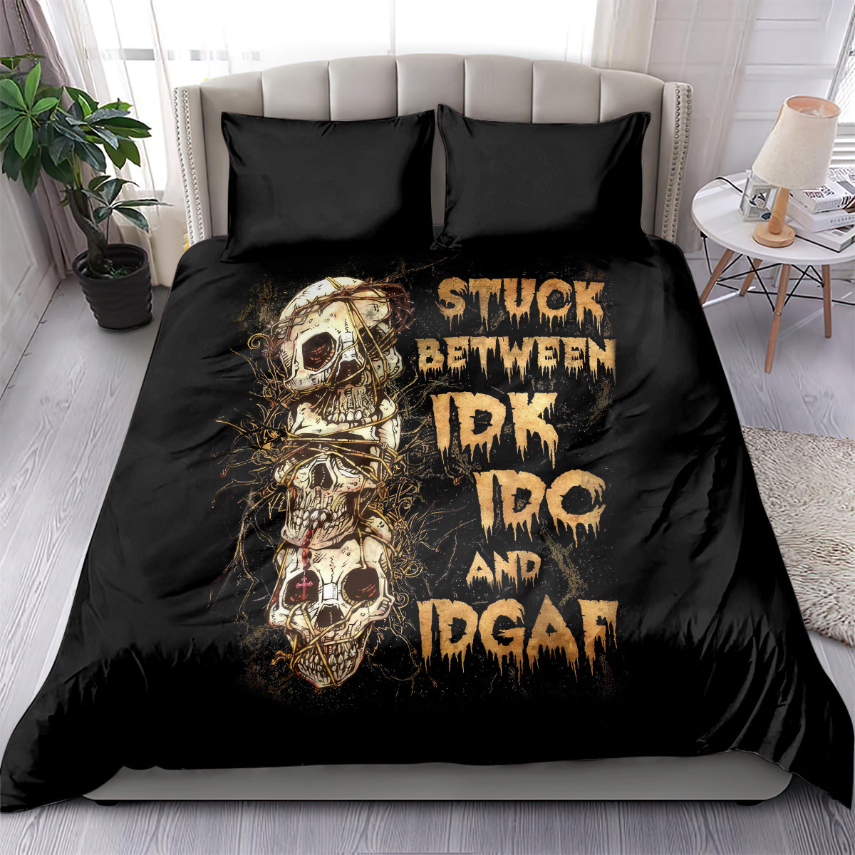 Black skull graphic bedding set with two matching pillows on a bed, front view