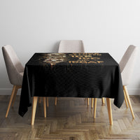 Black skull graphic tablecloth on square dining table with four chairs
