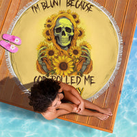 Yellow round beach blanket with sunflower skull graphic and white fringe edge