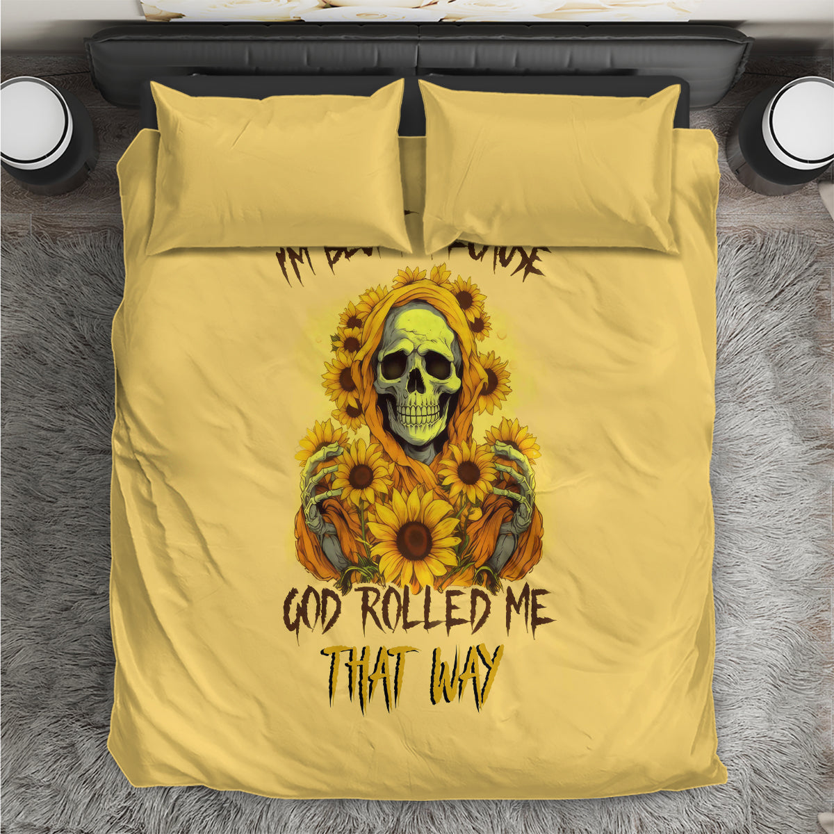 Yellow duvet with two matching pillows; central sunflower skull artwork with bold text.