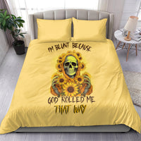Yellow bedding set with duvet and two pillows featuring a skull in sunflowers graphic.