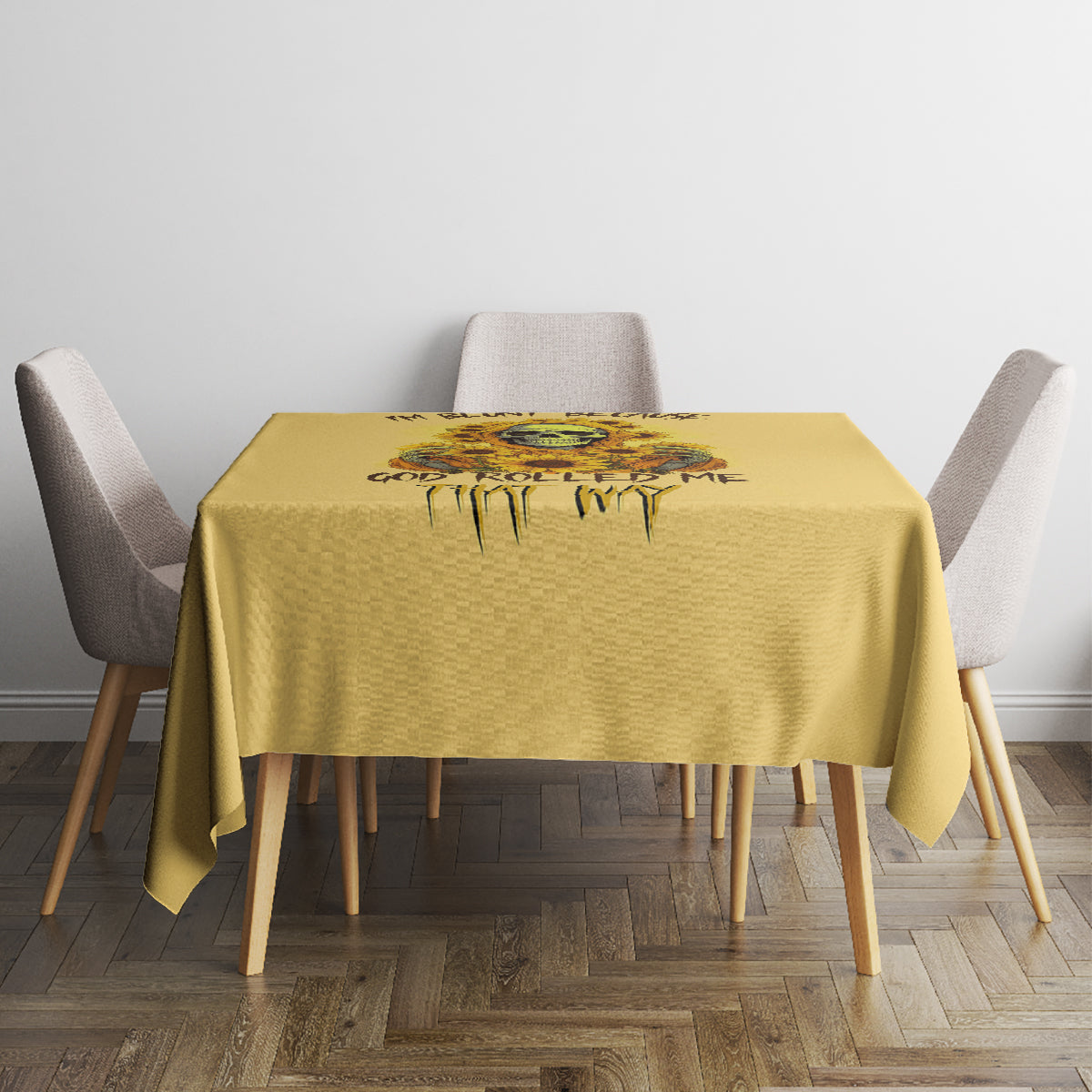 Yellow tablecloth with skull-and-sunflower drip graphic across the tabletop.