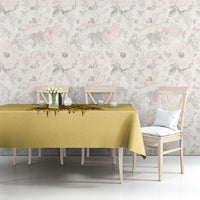 Yellow tablecloth with skull-and-sunflower drip design on the table surface.