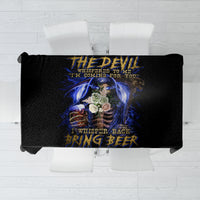 Black tablecloth with blue skull artwork and quote lettering, top-down over tabletop