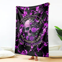 Purple skull rose blanket with bright lightning pattern, draped over couch