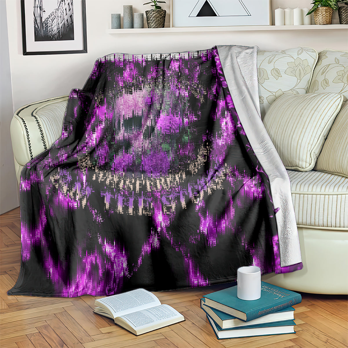Purple lightning skull and rose blanket draped on sofa with books nearby
