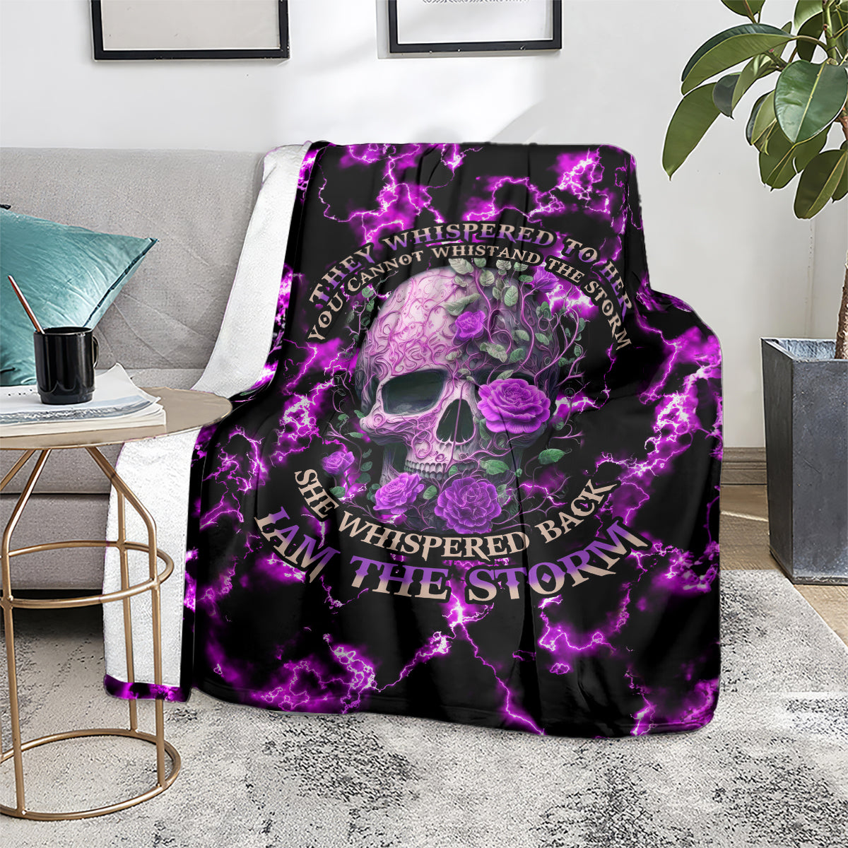 Purple skull rose blanket with glowing lightning border, folded over couch arm
