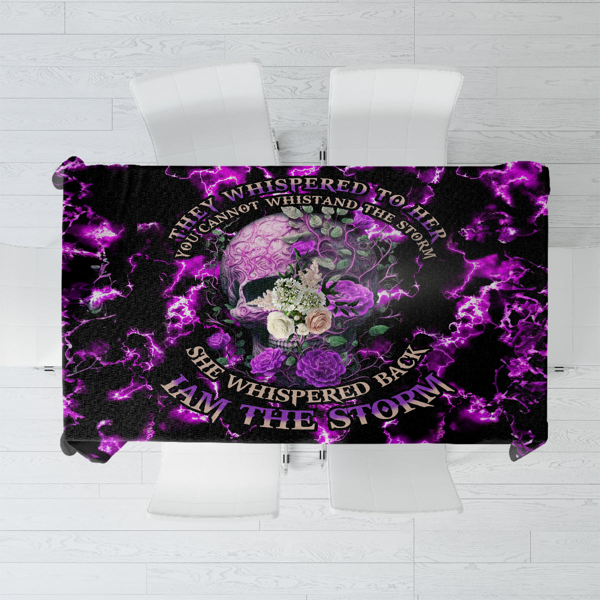 Purple tablecloth with skull and rose graphic and lightning, flat lay on chairs
