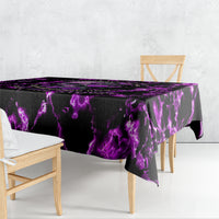Purple tablecloth with black base and purple lightning skull pattern, draped on table
