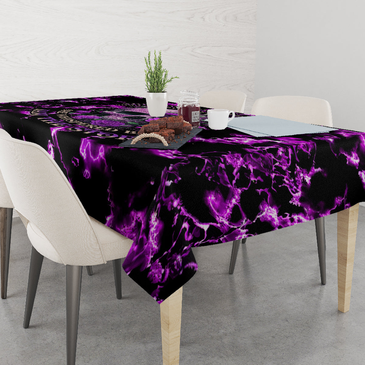 Purple and black lightning tablecloth draped over dining table edge