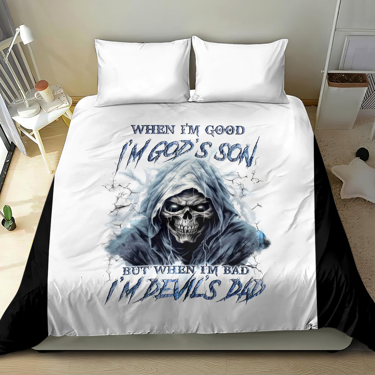 White bedding set with blue hooded skull artwork and text on duvet, two pillows