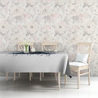 White tablecloth with blue skull graphic and text, spread across tabletop