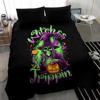 Black witch bedding set with neon skull and pumpkin graphic on duvet, 2 pillows