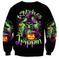 Black sweatshirt with witch skull graphic, green/purple text and jack-o-lantern