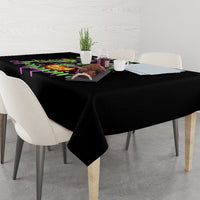 Black tablecloth with colorful dripping witch skull print on a dining table