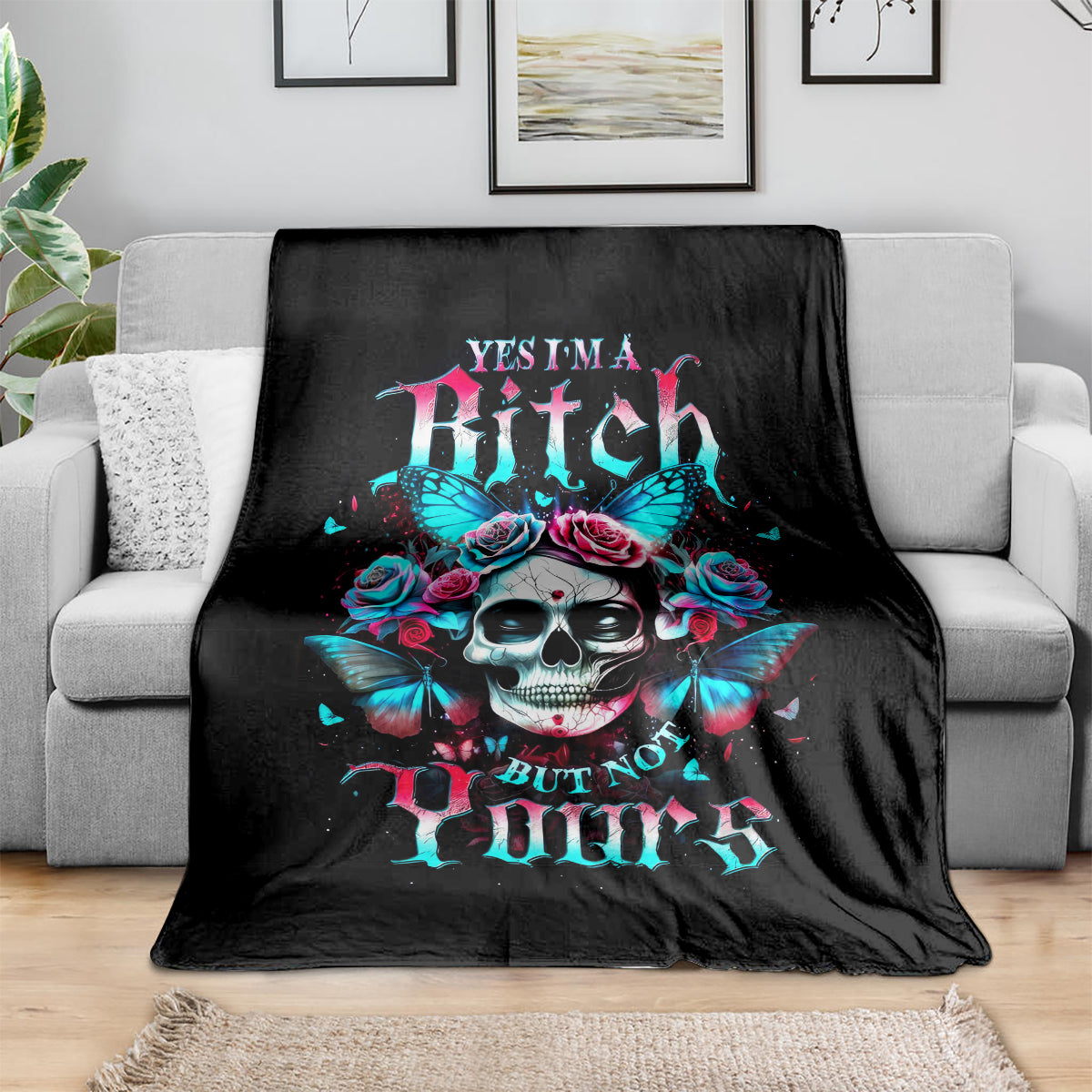 Black skull-and-butterfly graphic blanket with rose crown and bold slogan text