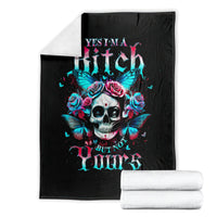 Black skull-and-butterfly blanket with rose crown, shown folded on a stack