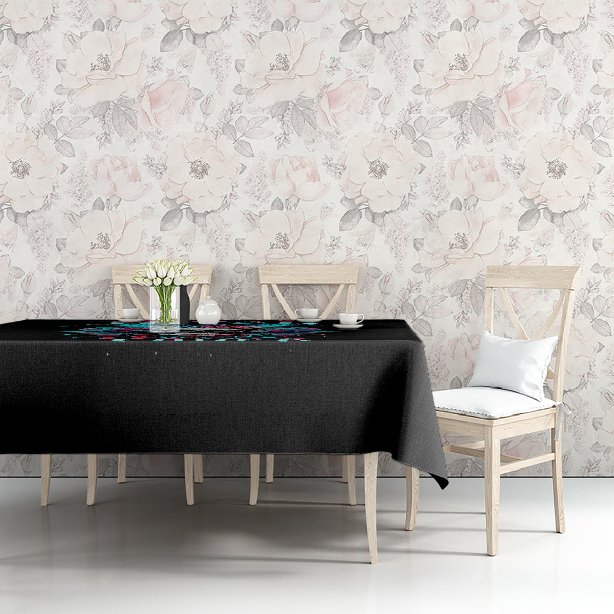 Black tablecloth with skull-and-butterfly graphic displayed across a dining table.