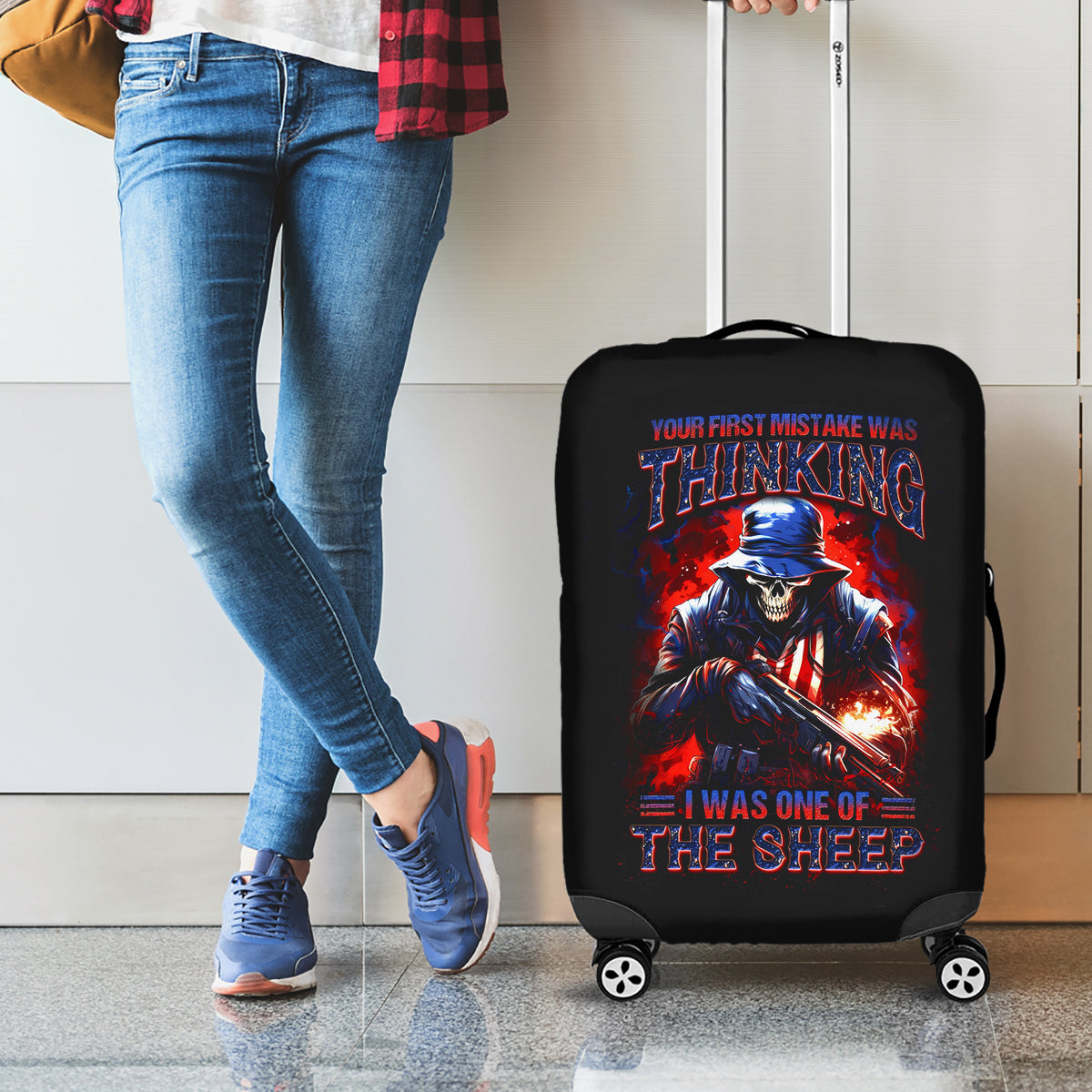 Black luggage cover with red graphic of a skull soldier and warning text