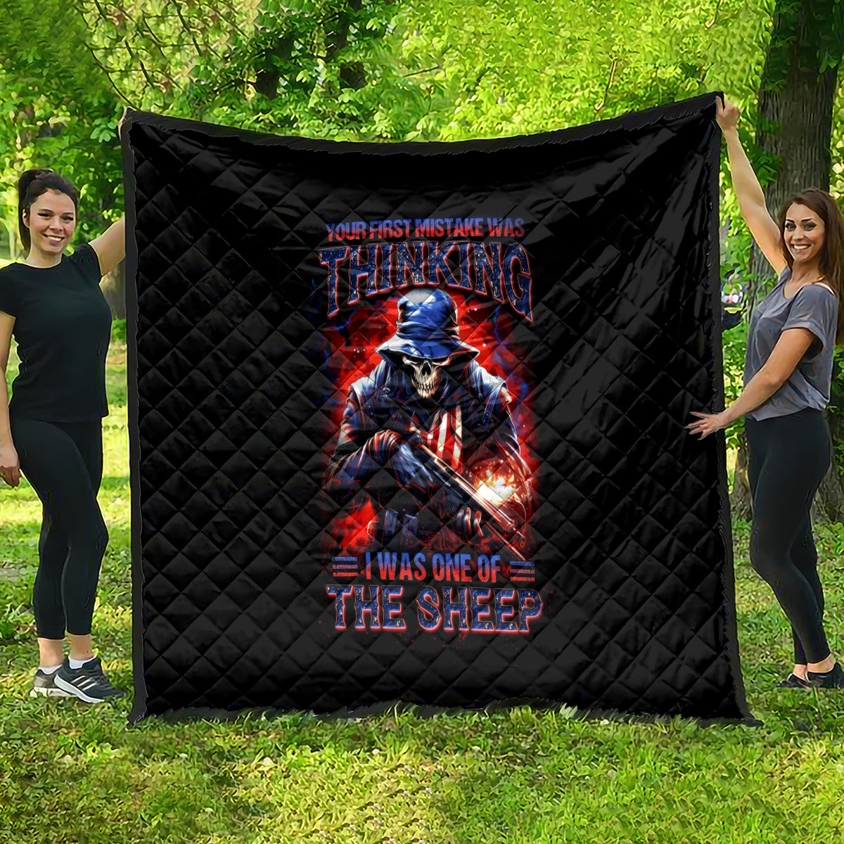 Black quilt with diamond quilting and a skull-sheep warrior graphic in red and blue