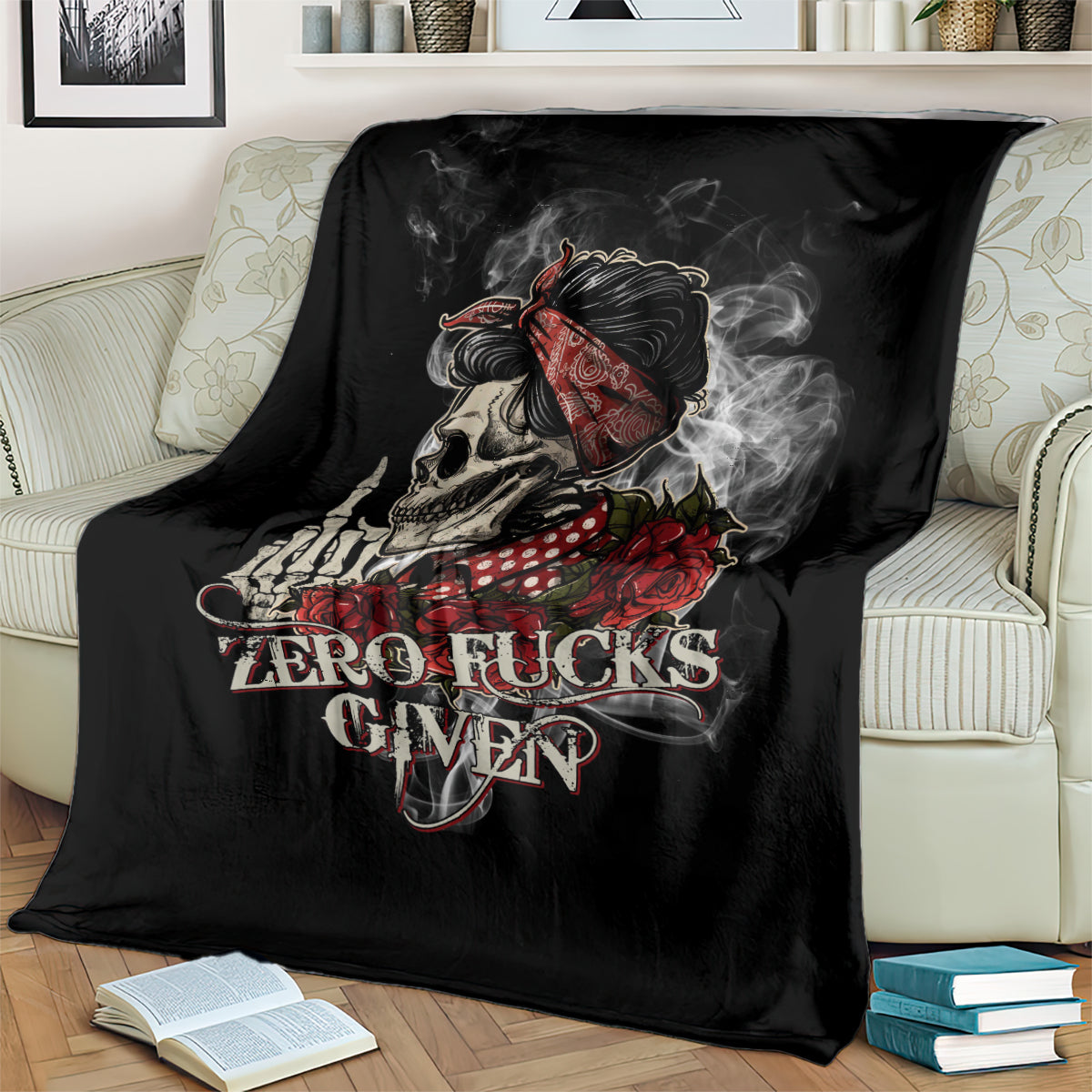 Black skull and rose graphic blanket draped on a striped sofa