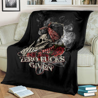 Black skull and rose graphic blanket draped on a striped sofa