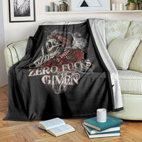 Black skull and rose throw blanket with 'ZERO FUCKS GIVEN' text over armchair
