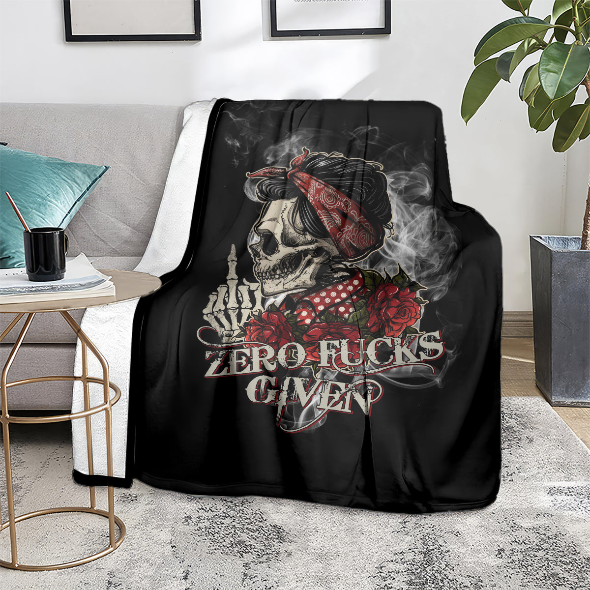 Black skull and rose graphic blanket on couch near a side table