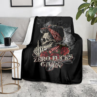 Black skull and rose graphic blanket on couch near a side table