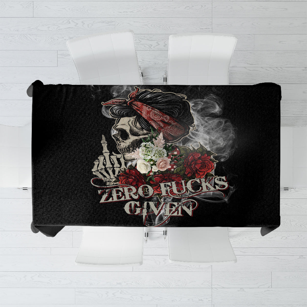 Black tablecloth with skull and roses, bold 'ZERO F*CKS GIVEN' lettering in the center.