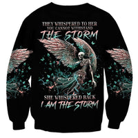 Black unisex sweatshirt with back angel-skull storm graphic and teal wing lettering
