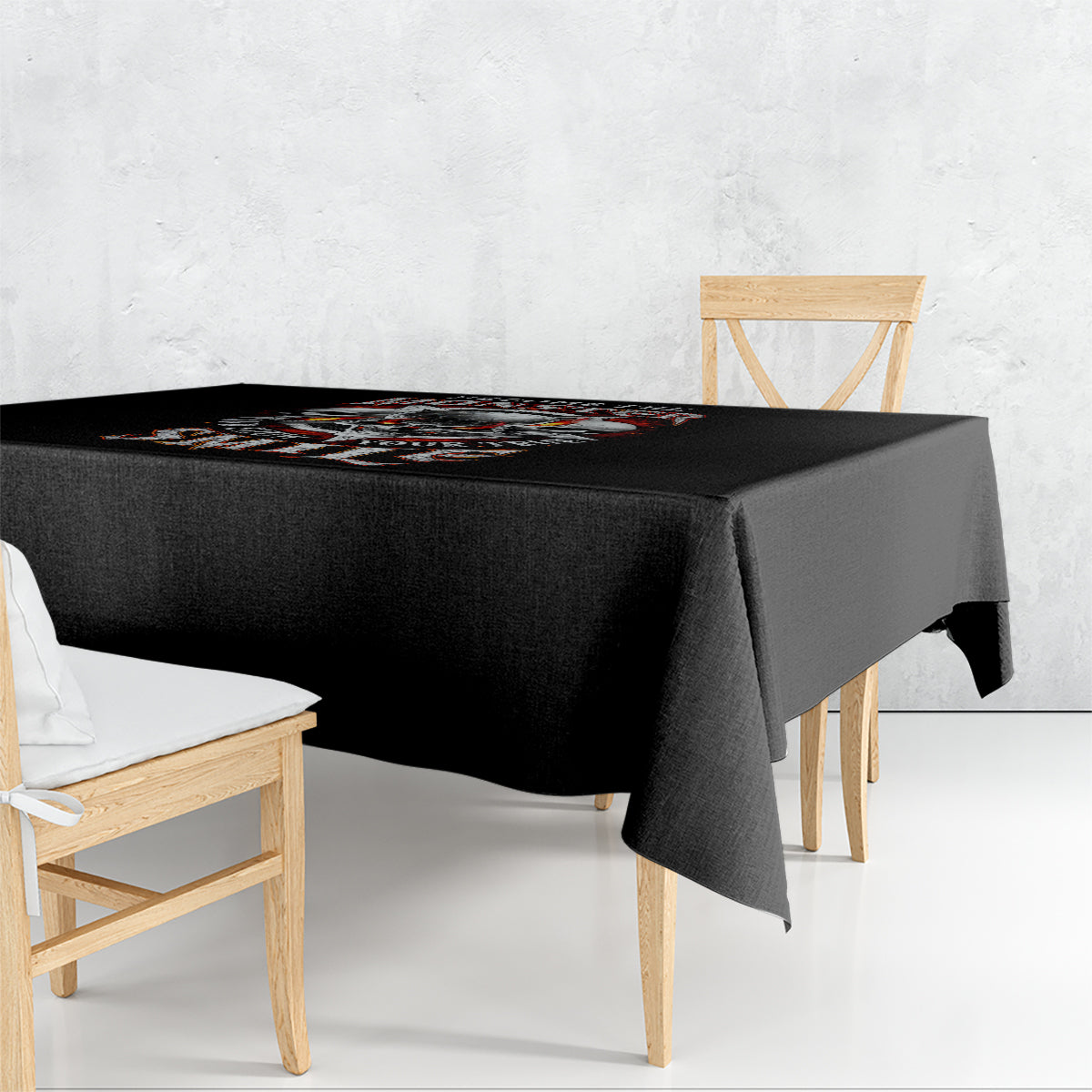 Black tablecloth with skull graphic, draped over a table corner edge