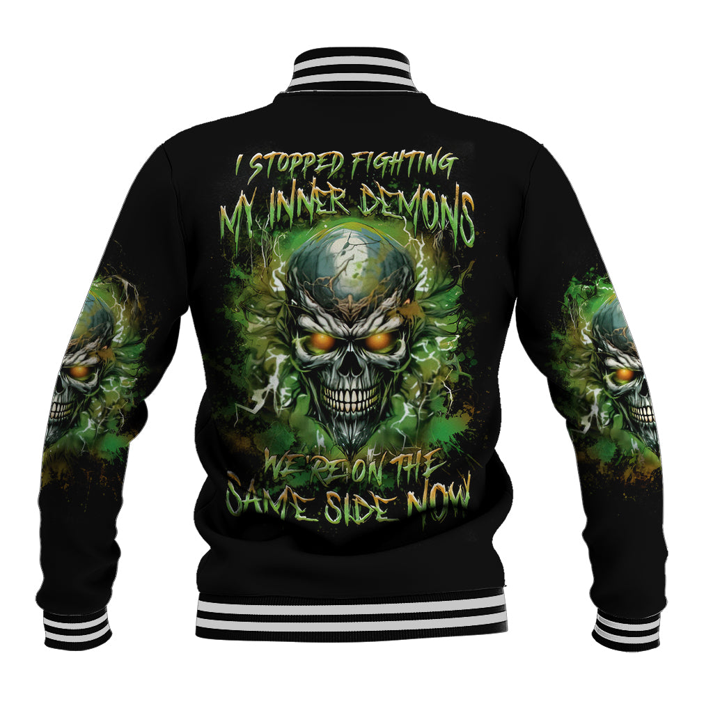 Black baseball jacket with striped ribbed collar and back skull demon graphic, unisex.