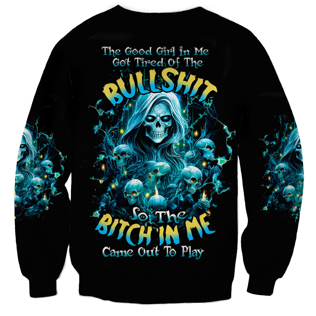Black crewneck sweatshirt with blue skull graphic and slogan, long sleeves