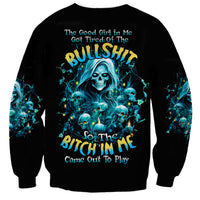 Black crewneck sweatshirt with blue skull graphic and slogan, long sleeves