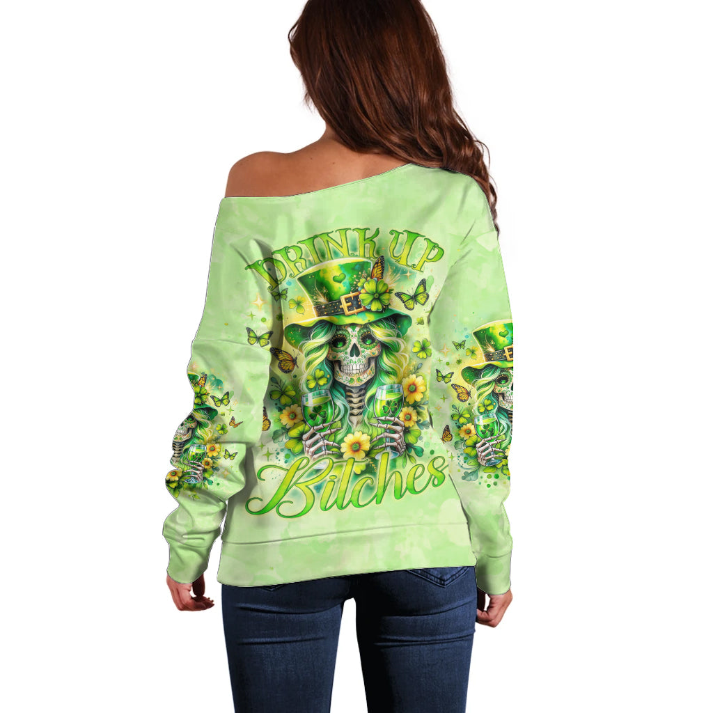 Green off-shoulder sweater, back print with skull and “Drink up Bitches” text