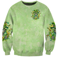 Green unisex sweatshirt with small chest graphic and butterfly print on both sleeves