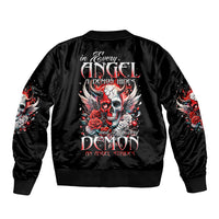 Black bomber jacket with angel-and-demon skull graphic on back, ribbed collar and cuffs