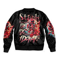 Black satin bomber jacket with large back devil skull graphic and ribbed hem cuffs