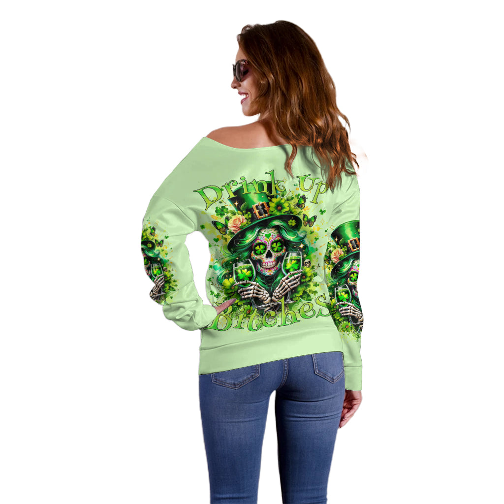 Light green off-shoulder sweater with back skull graphic, long sleeves, relaxed fit