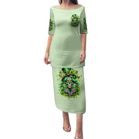 Green long dress with 3/4 sleeves; skull graphic on front and skirt hem